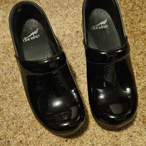 Dansko Women's Black Patent Leather Clogs